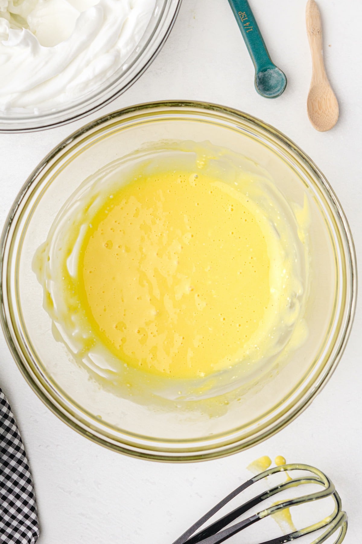 mixture of egg yolks, salt, and cream cheese in a bowl