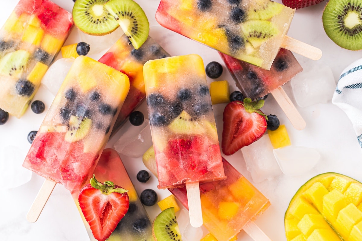 fruit popsicles scattered on the table 