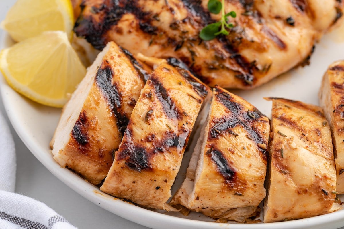 grilled chicken breast on a white plate