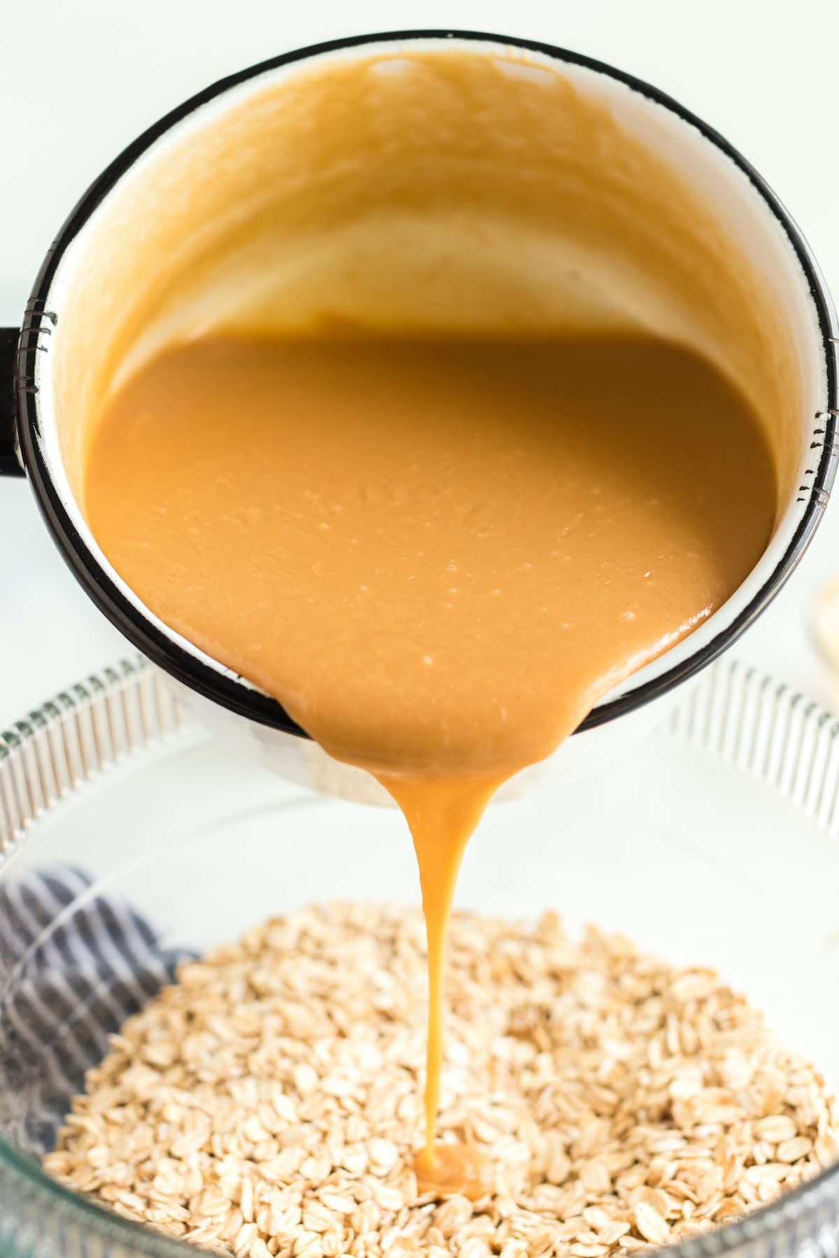 Pour the peanut butter mixture over oats