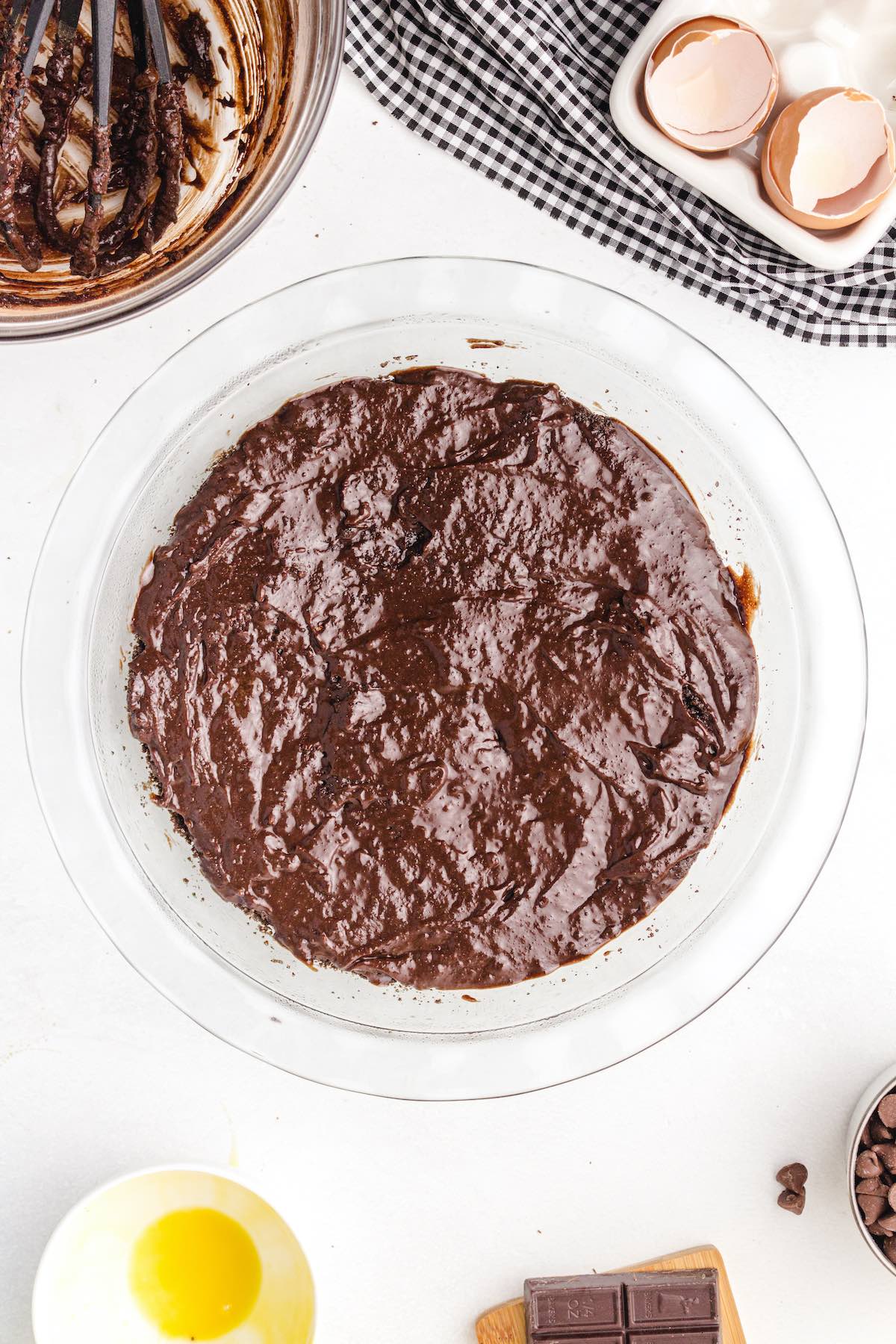 spread brownie layer on top of the crust layer