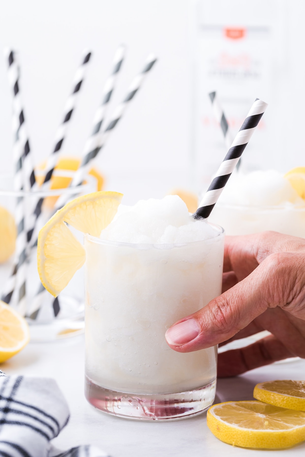 hand holding frozen lemonade