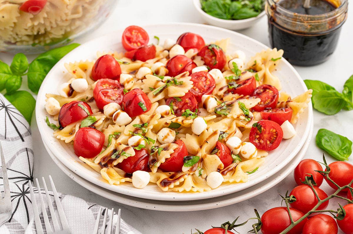 caprese pasta salad served in a plate. 