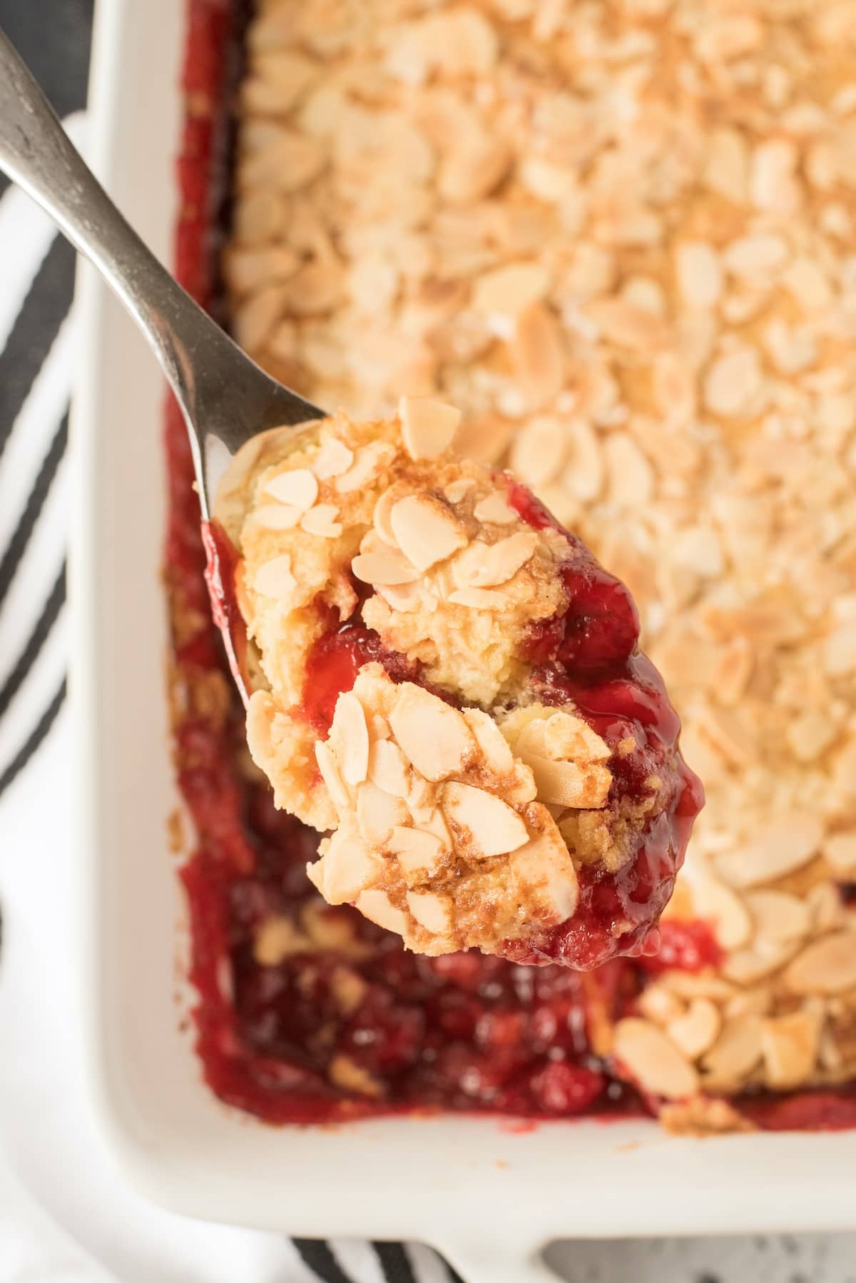 cherry dump cake on the spoon