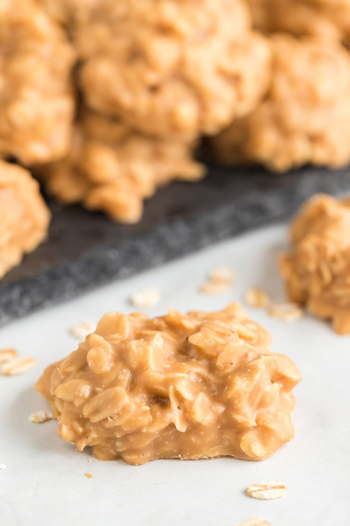 a couple of peanut butter no bake cookies on the table.