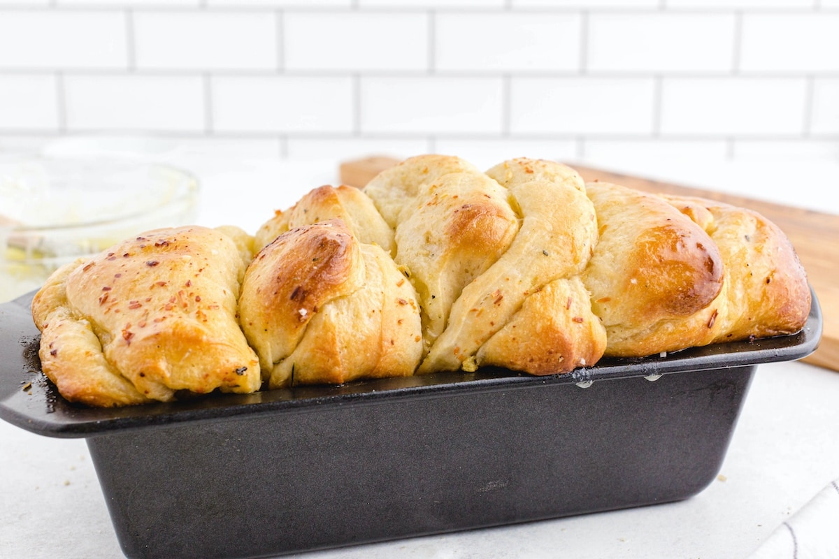 tear and share garlic bread inside loaf pan