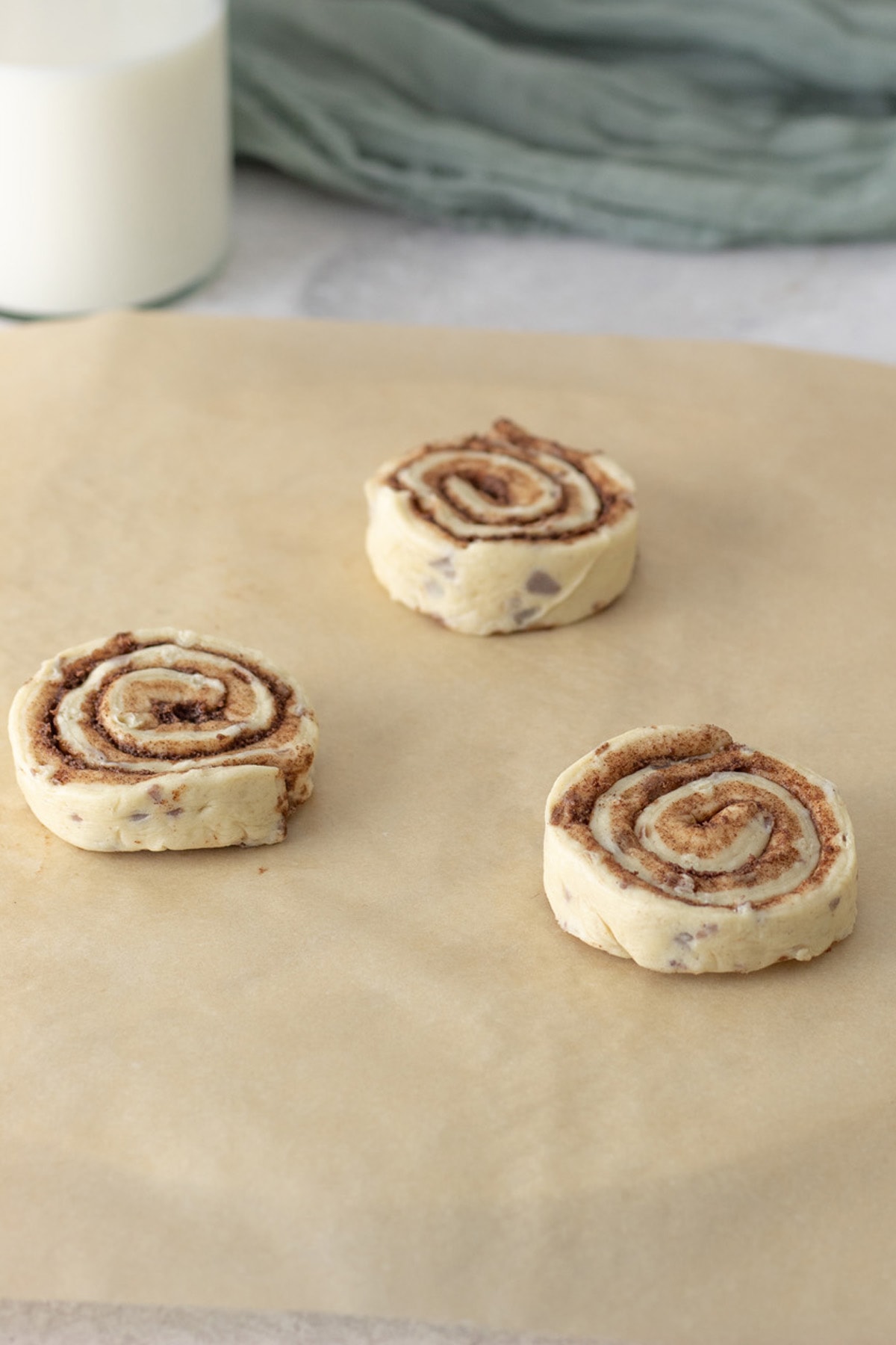 place cinnamon rolls on a piece of wax paper