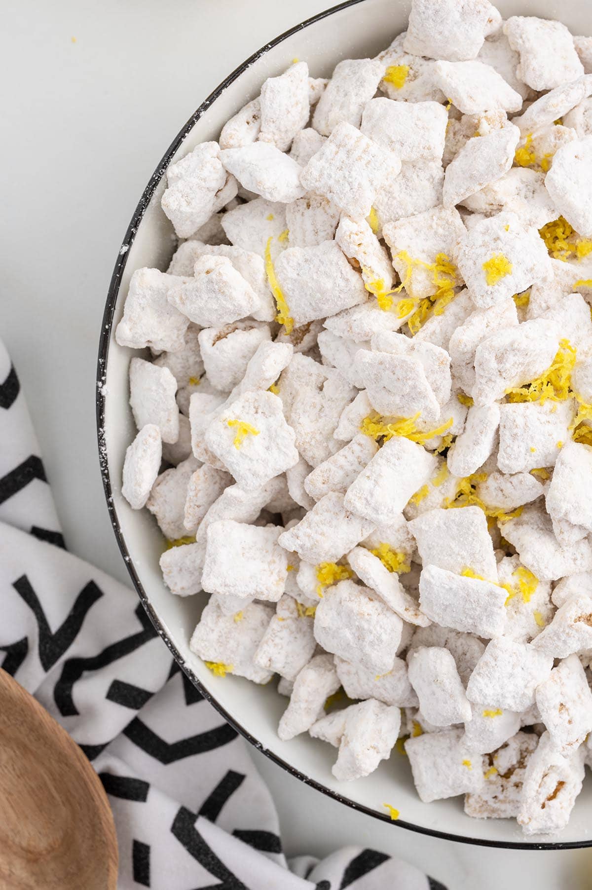 lemon puppy chow with lemon zest on top. 