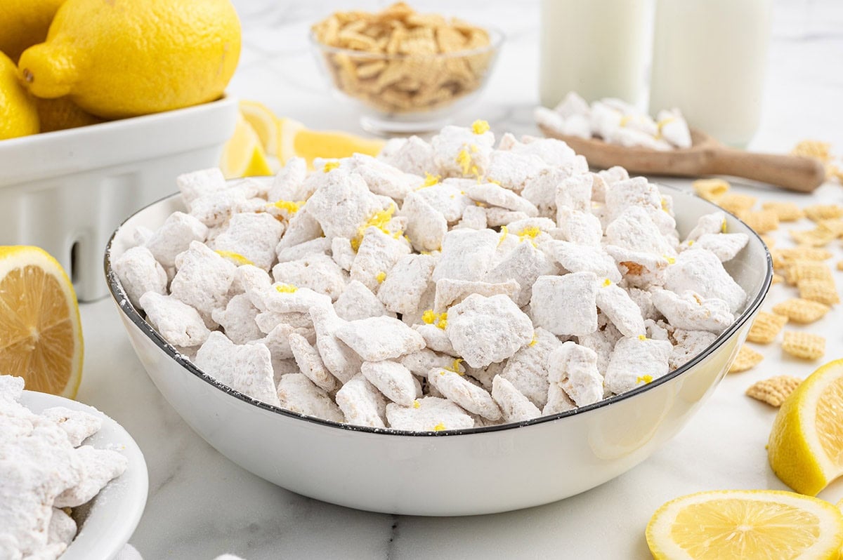 lemon puppy chow served in a white bowl. 