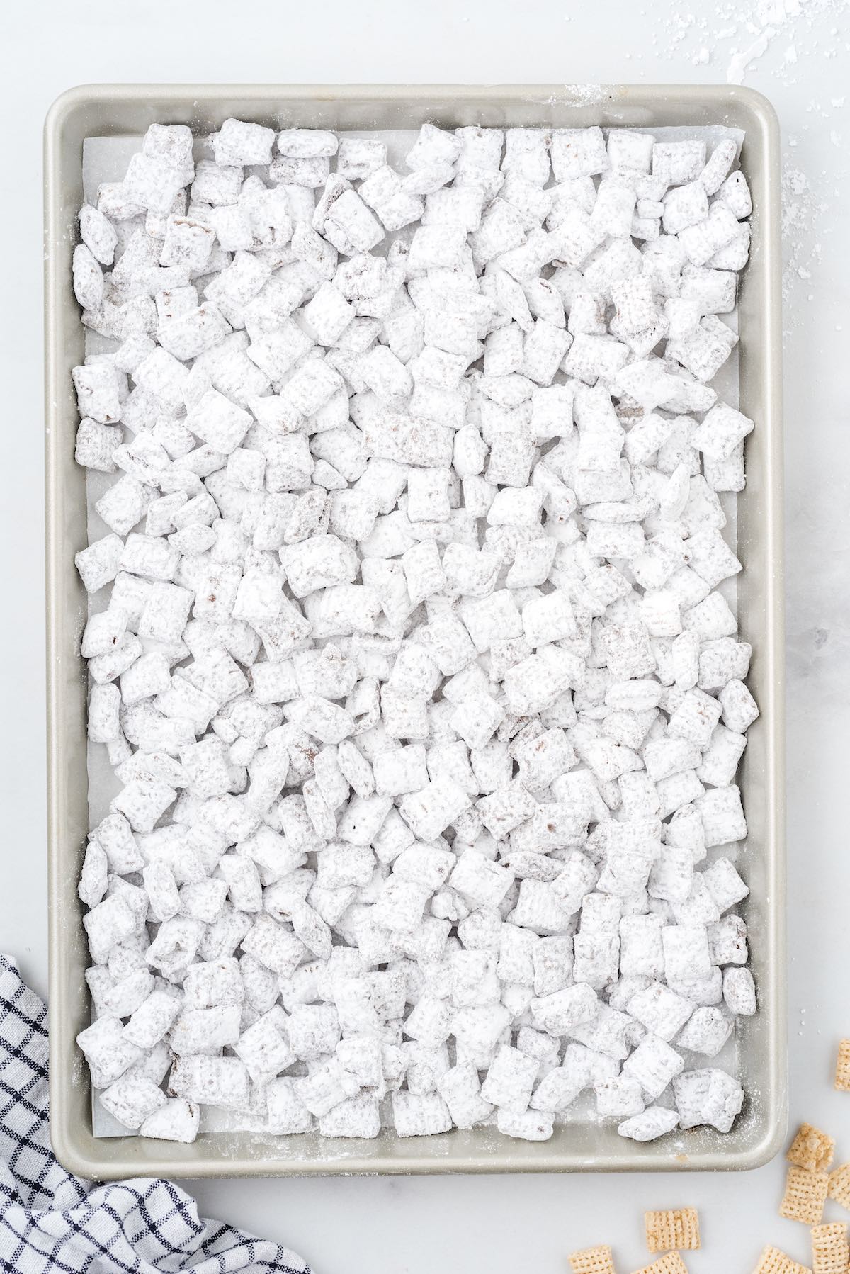 chocolate puppy chow in baking pan
