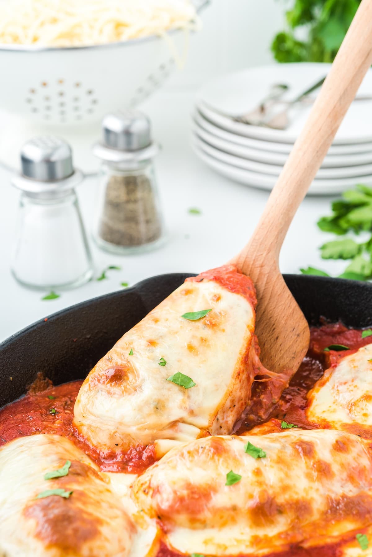 chicken mozzarella lifted with wooden spoon