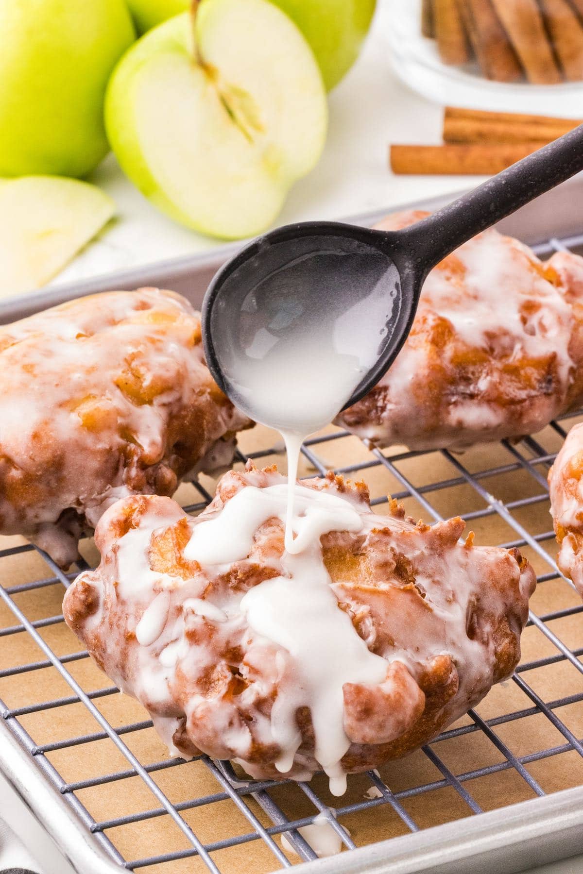 apple fritter drizzled with glaze. 