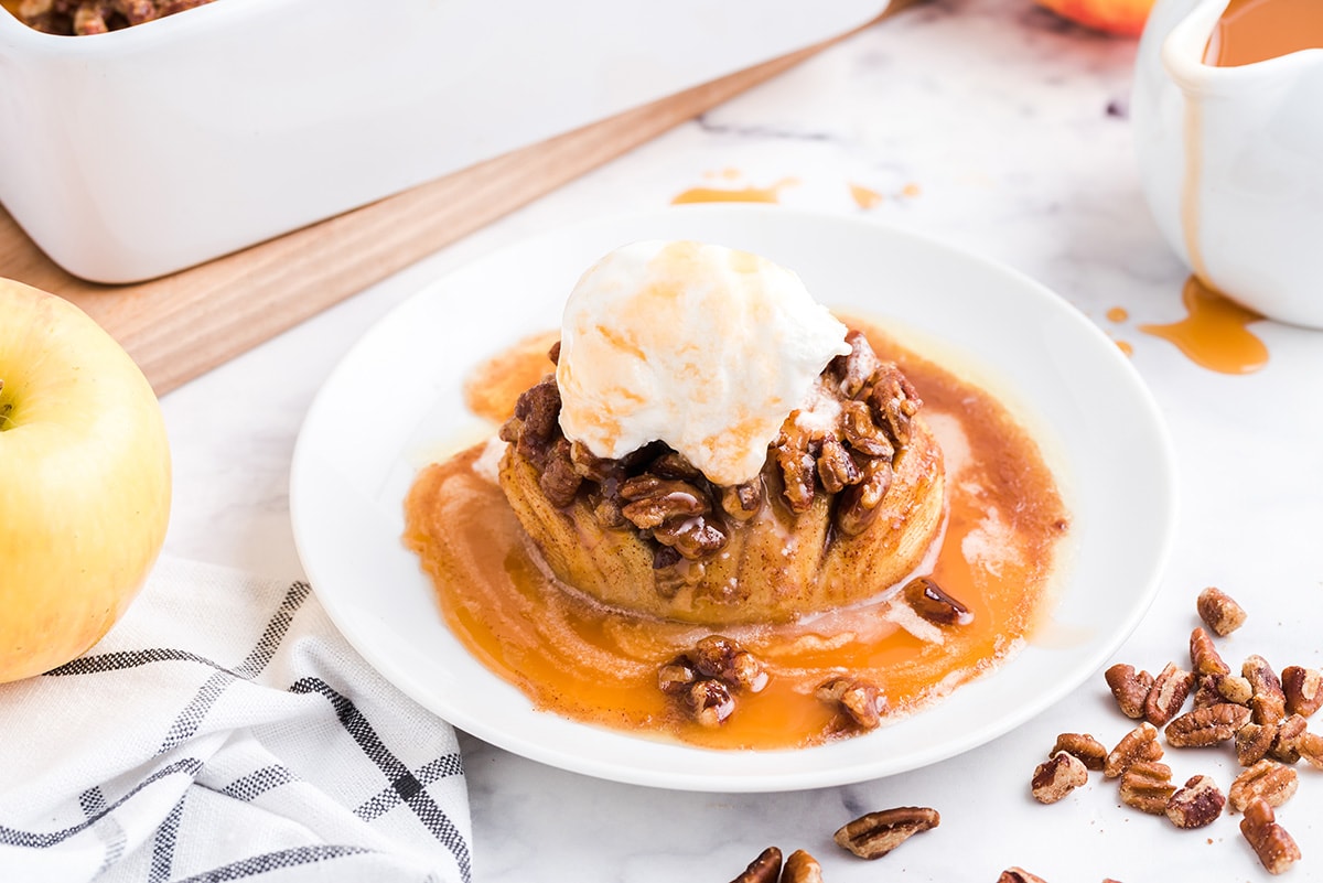 hasselback apples with ice cream topping on a plate