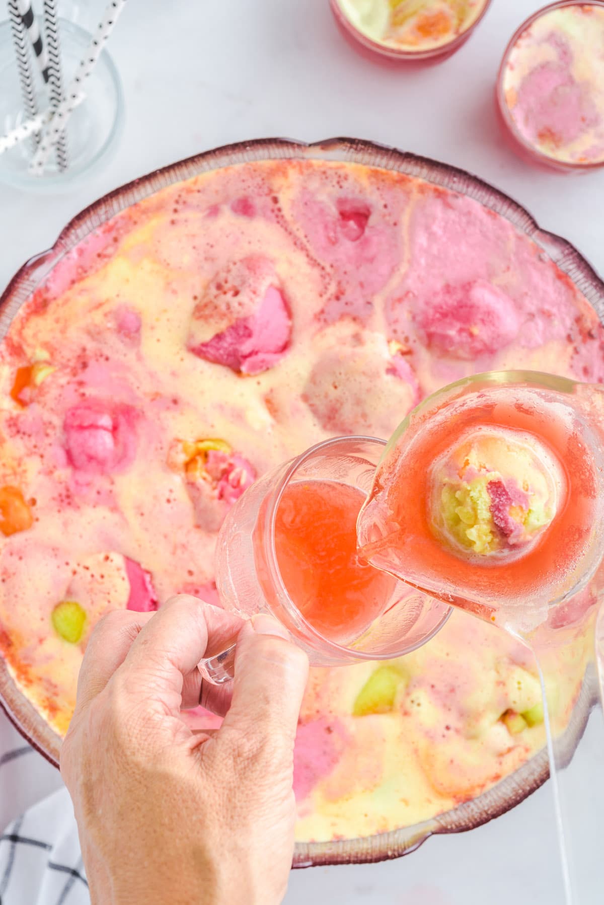 rainbow sherbet punch poured into a glass.