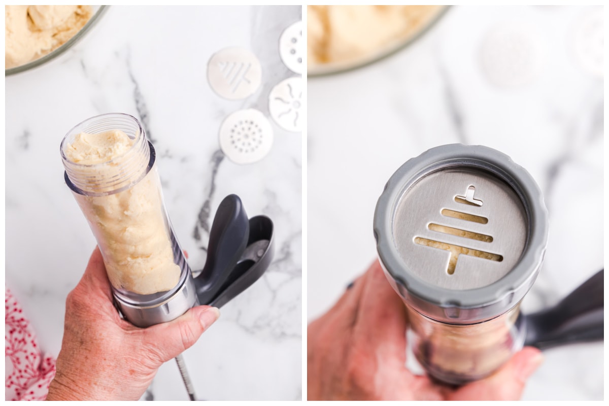 Fill the cookie press tube with cookie dough