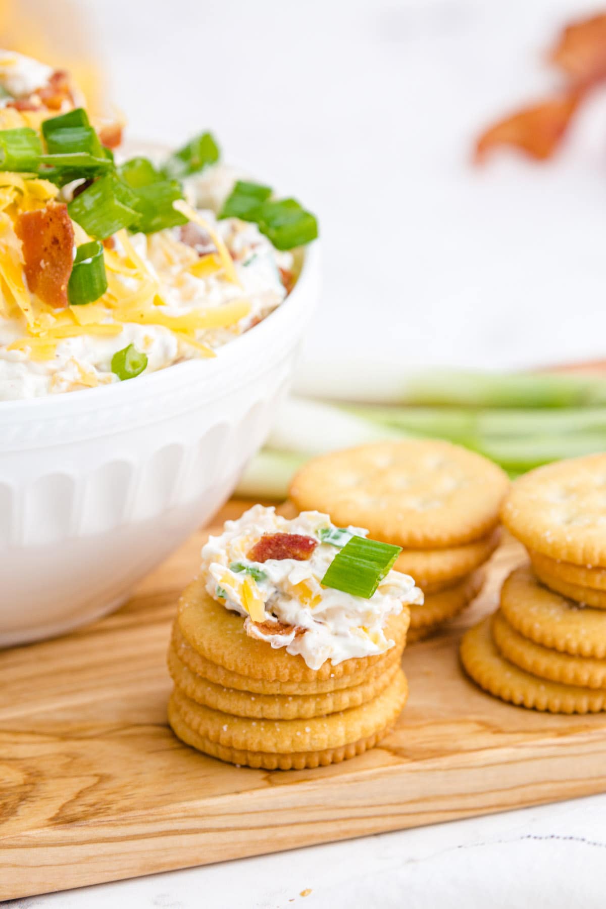 eating the dip with crackers