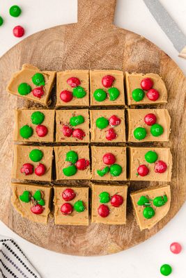 cut peanut butter fudge and add M&M's on top