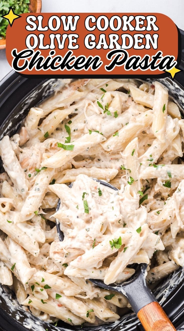 Slow cooker Olive Garden chicken pasta with creamy sauce, penne, and shredded chicken in a slow cooker