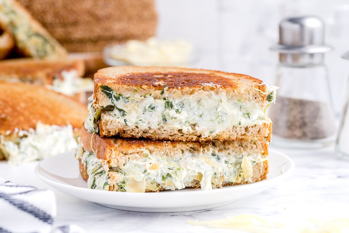 spinach and artichoke grilled cheese on the plate