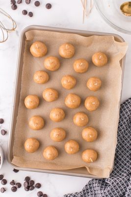 Roll dough into 1" balls and place toothpick on top of each ball