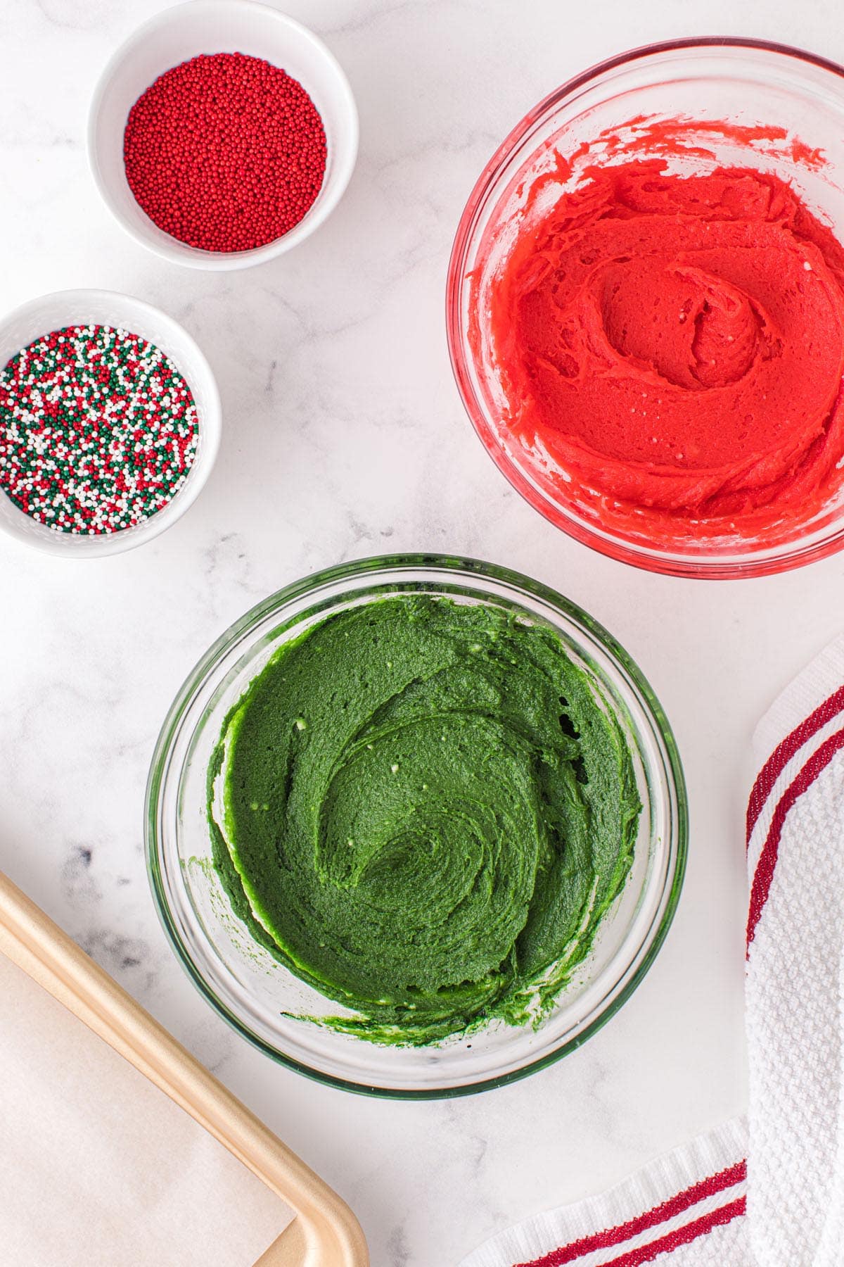 Add red and green food coloring to the dough