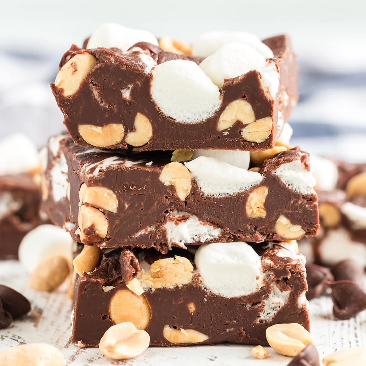 rocky road fudge cut in squares and stacked on top of each other.