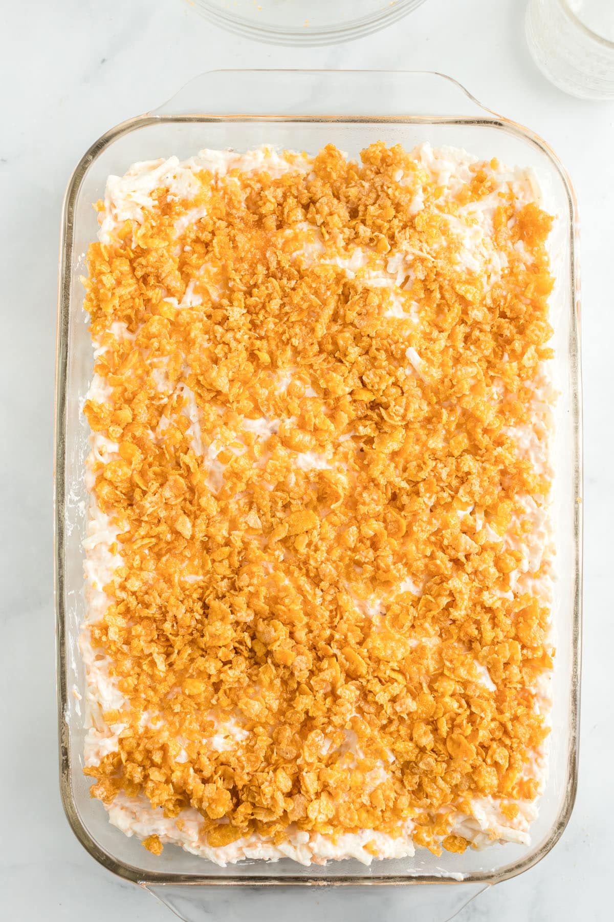 sprinkle corn flake mixture evenly over the top of the casserole