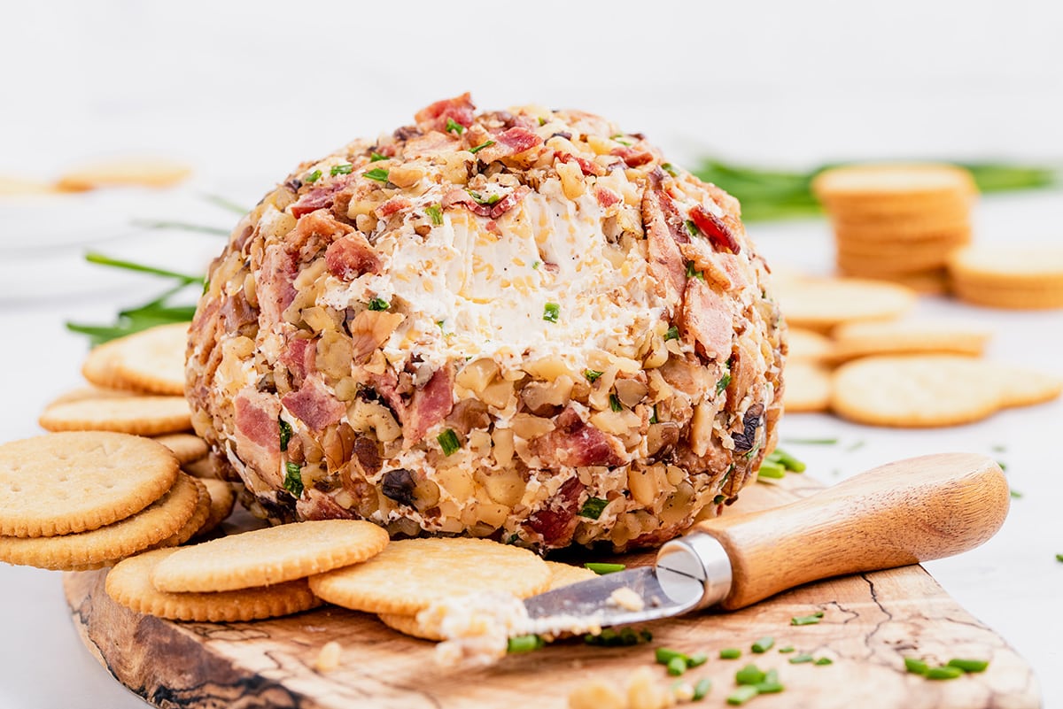 bacon cheese ball on a wooden tray