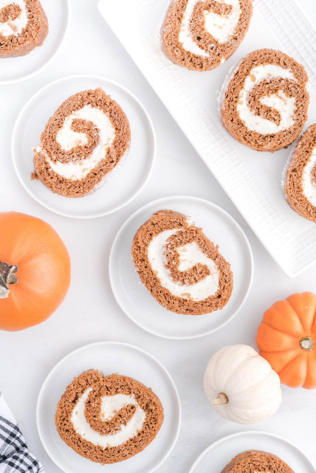 slices of pumpkin roll in different plates