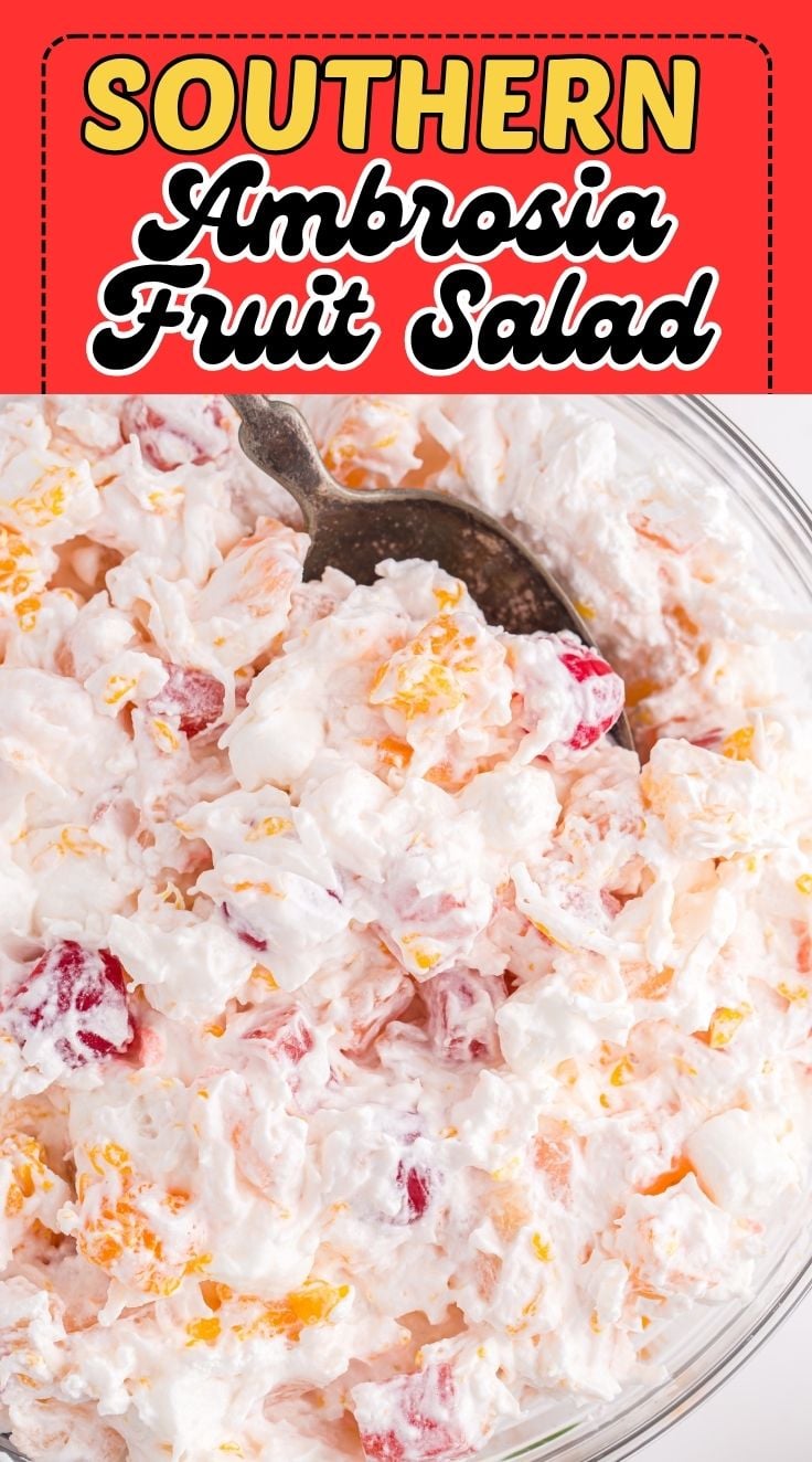 A spoon digging into creamy Ambrosia salad