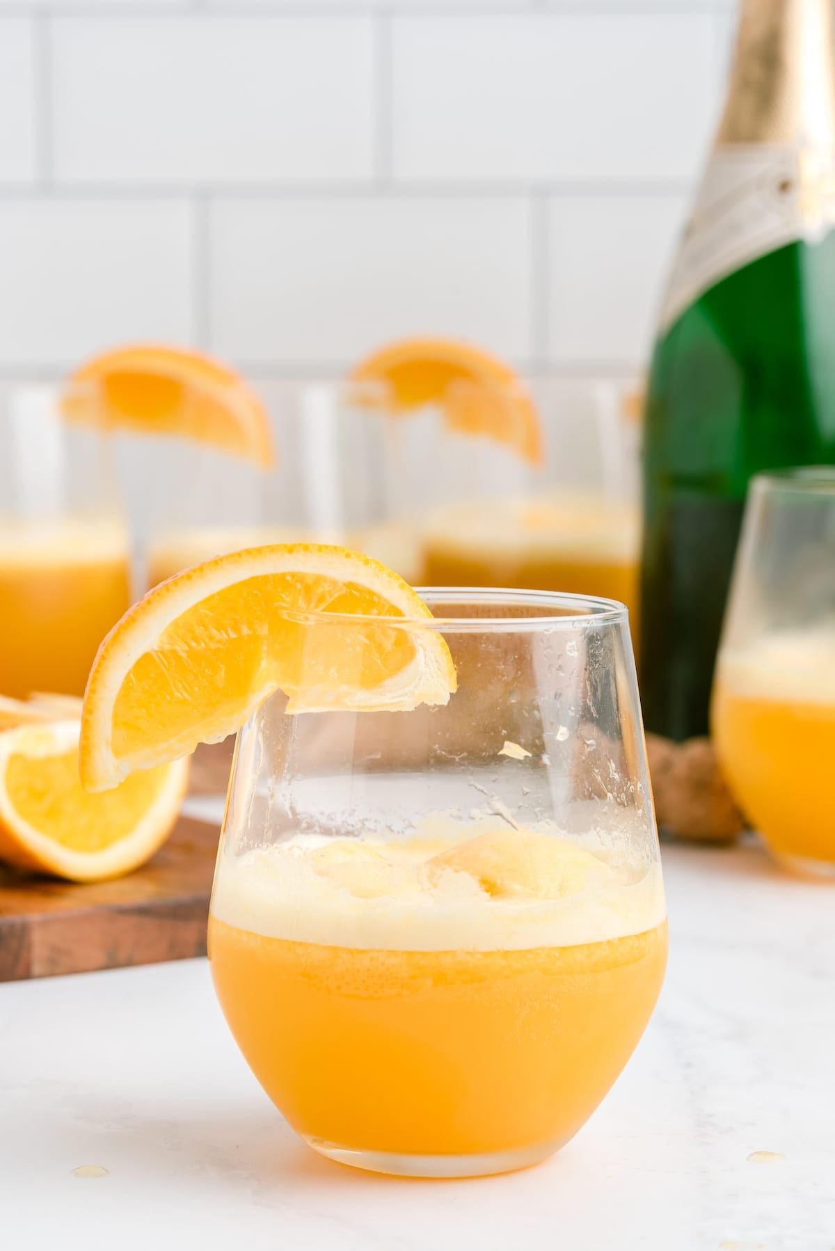 mimosa float in the glass garnish with a slice of orange