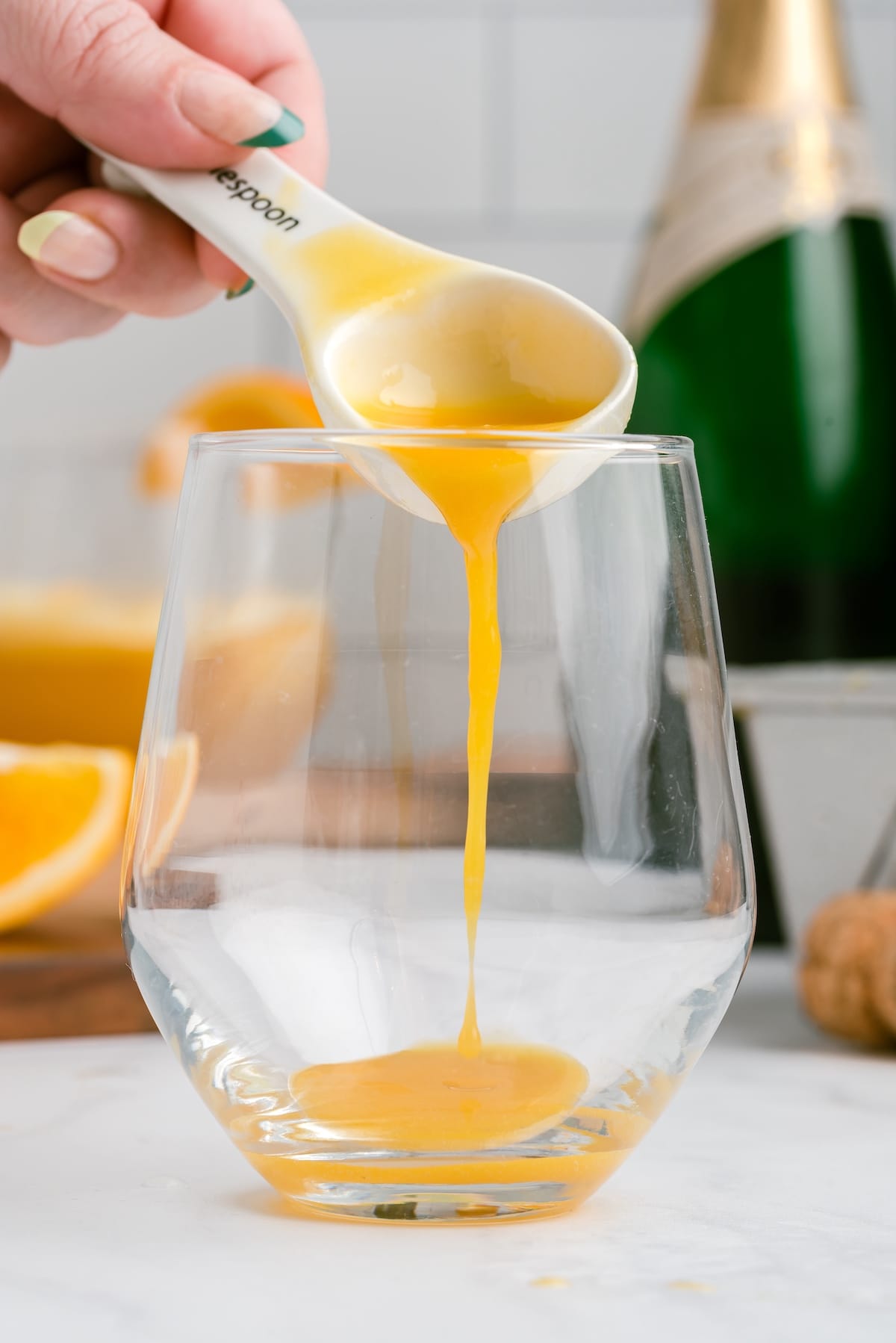 Add orange juice concentrate into the glass