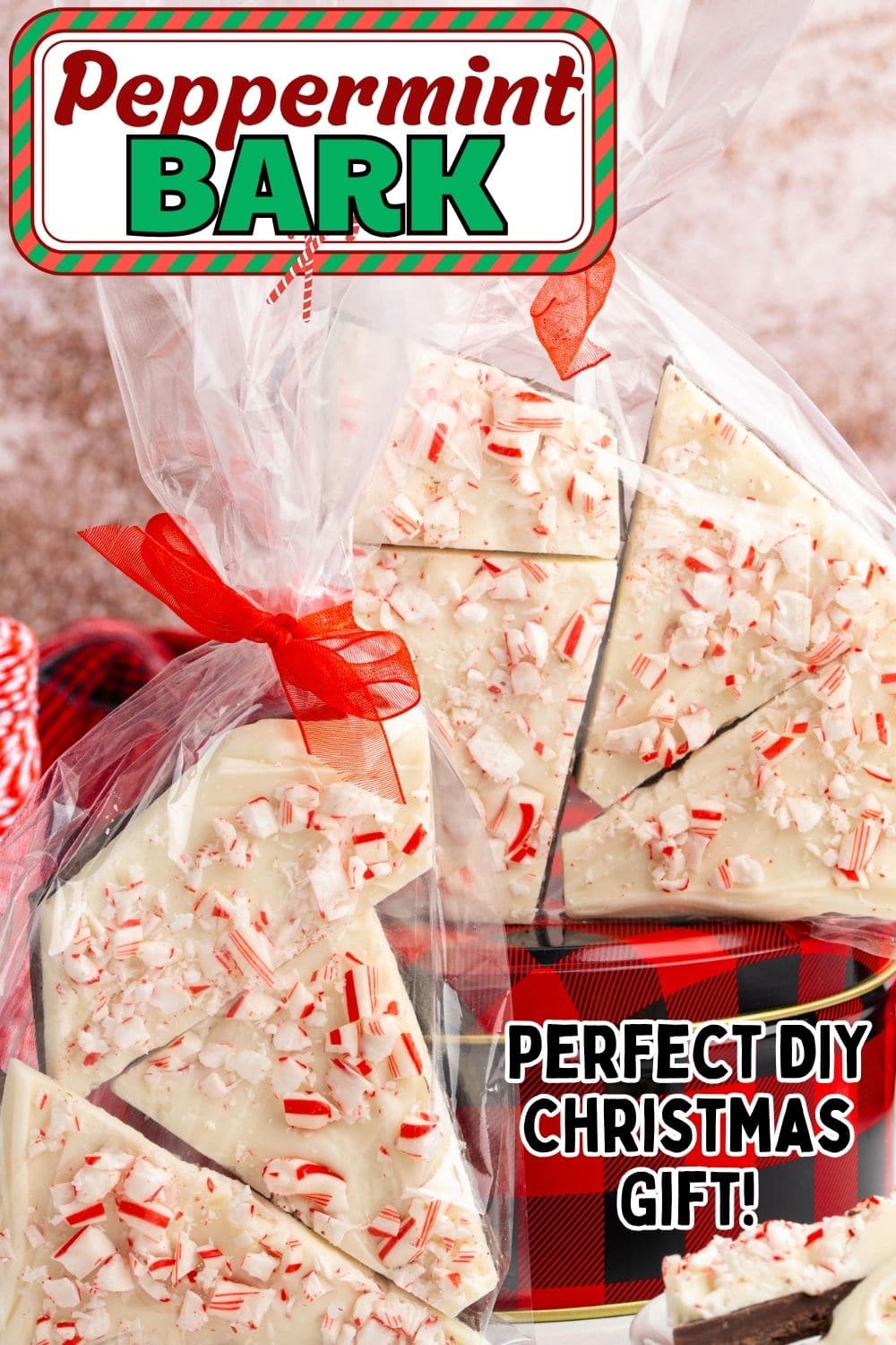 Peppermint Bark wrapped in a clear plastic bag decorated with red ribbon