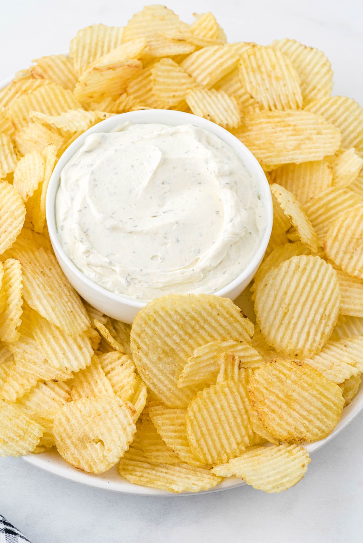 chip dip with chips on a plate