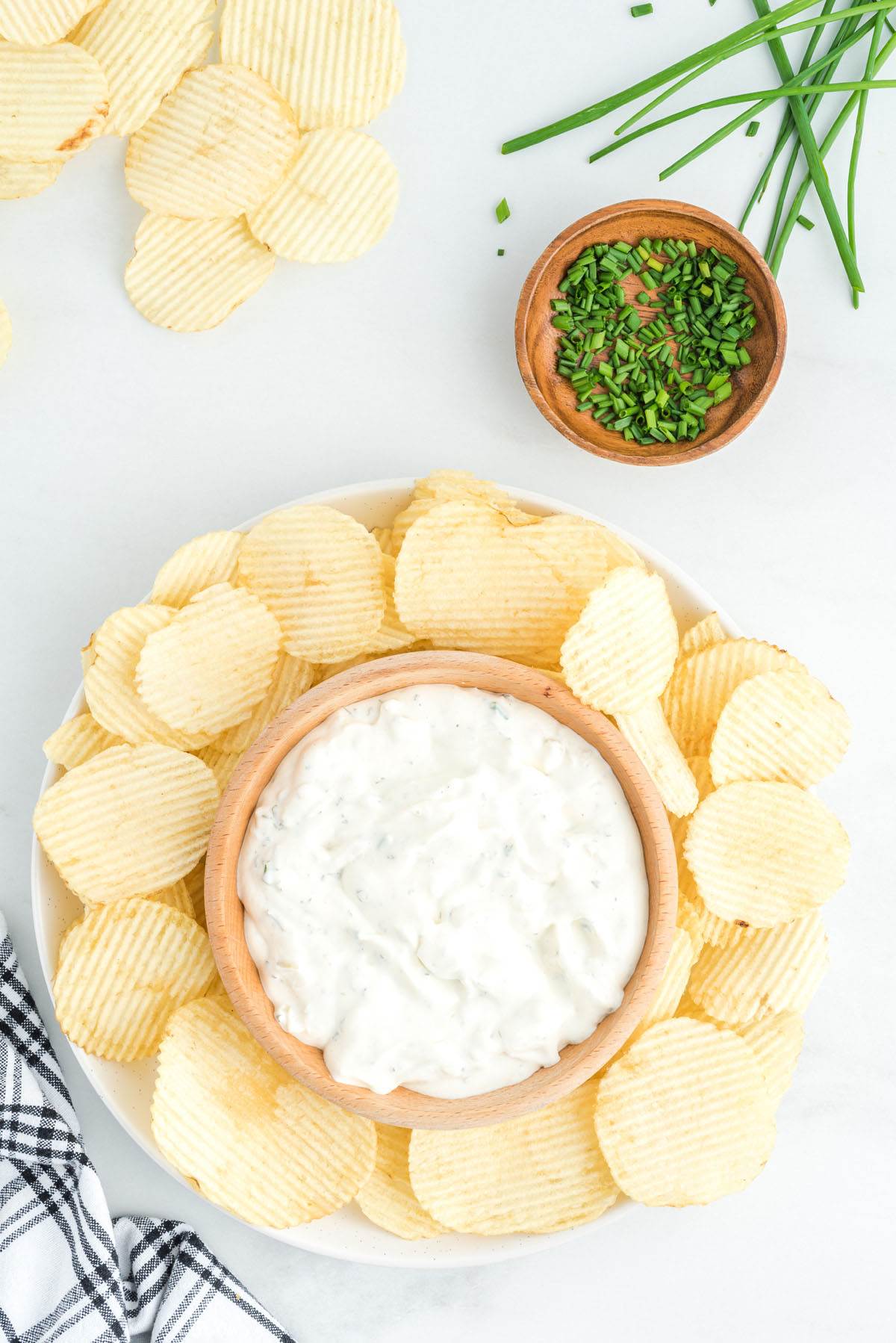 french onion dip with surrounded with chips