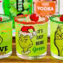 grinch cocktail in a grinch themed glass.