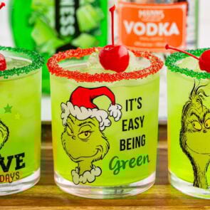 grinch cocktail in a grinch themed glass.