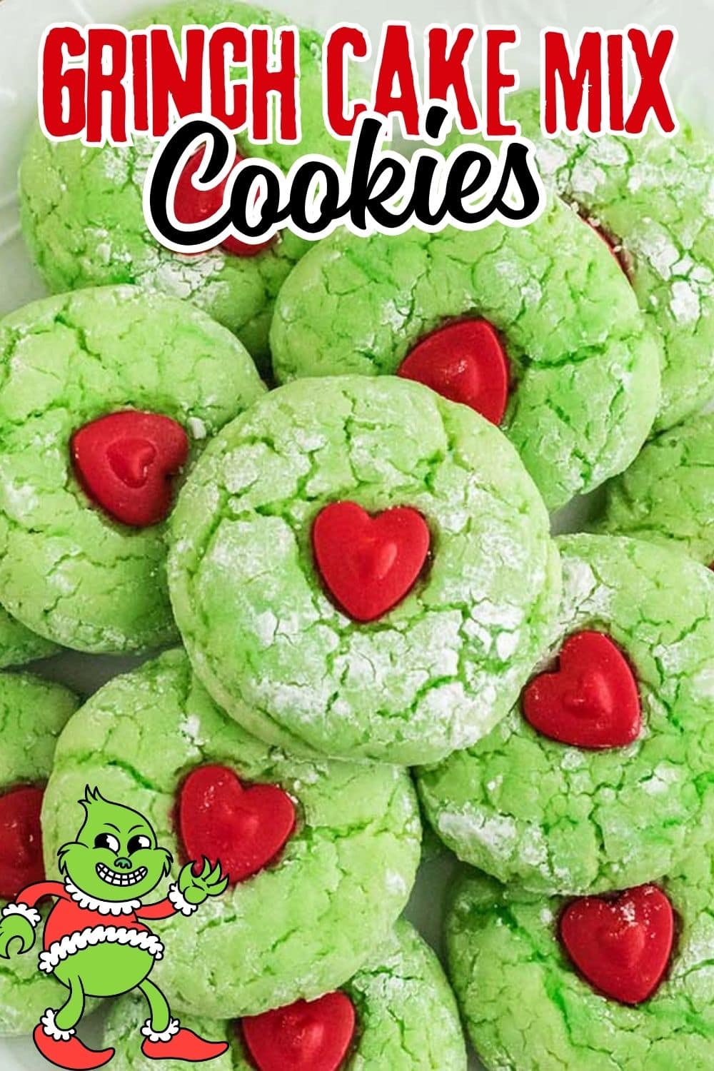 Close up of Grinch Cake Mix Cookies decorated with candy hearts and dusted with sugar