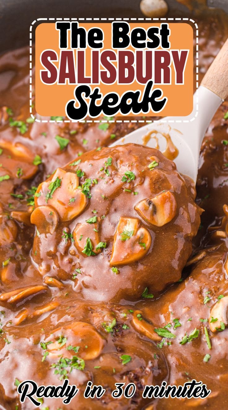 A silicone spatula digging into Salisbury Steak