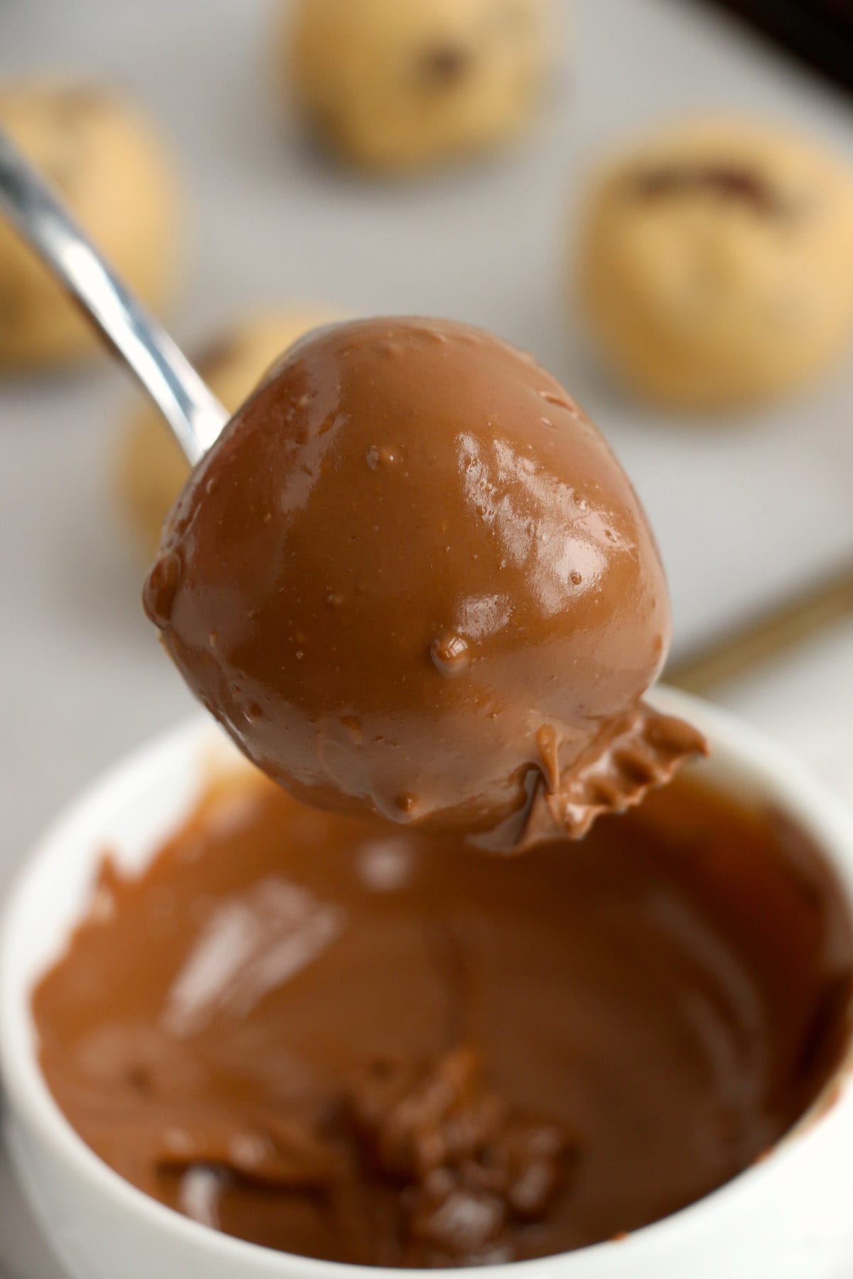 dip the balls into the melted chocolate
