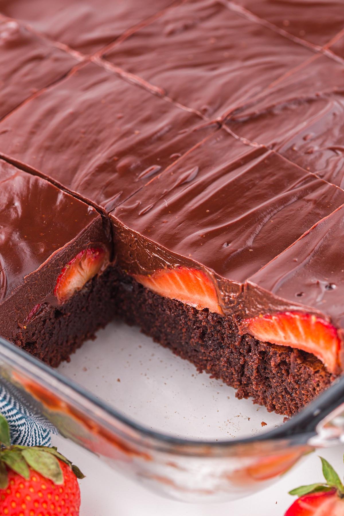 slices of Chocolate Covered Strawberry Brownies in baking pan