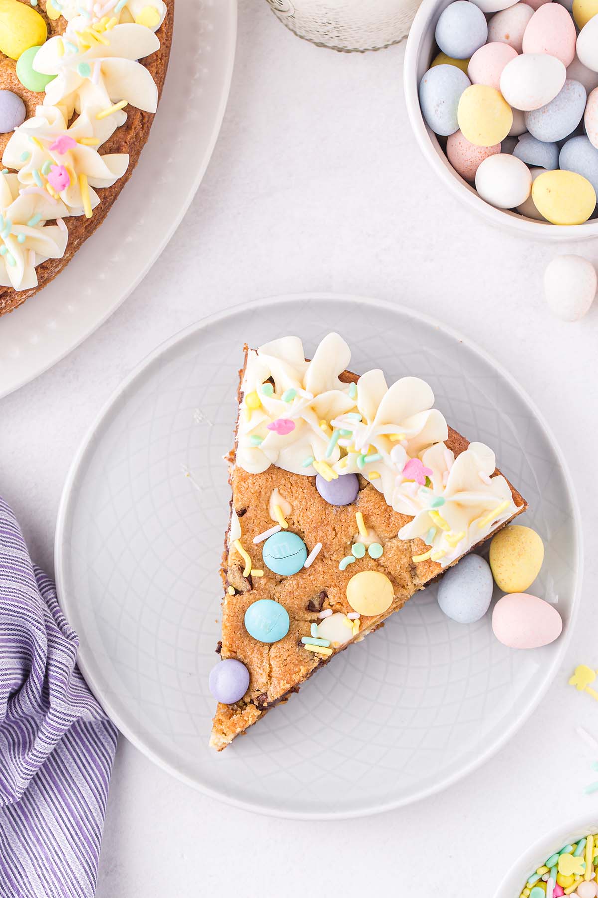 a slice of easter cookie cake on a plate