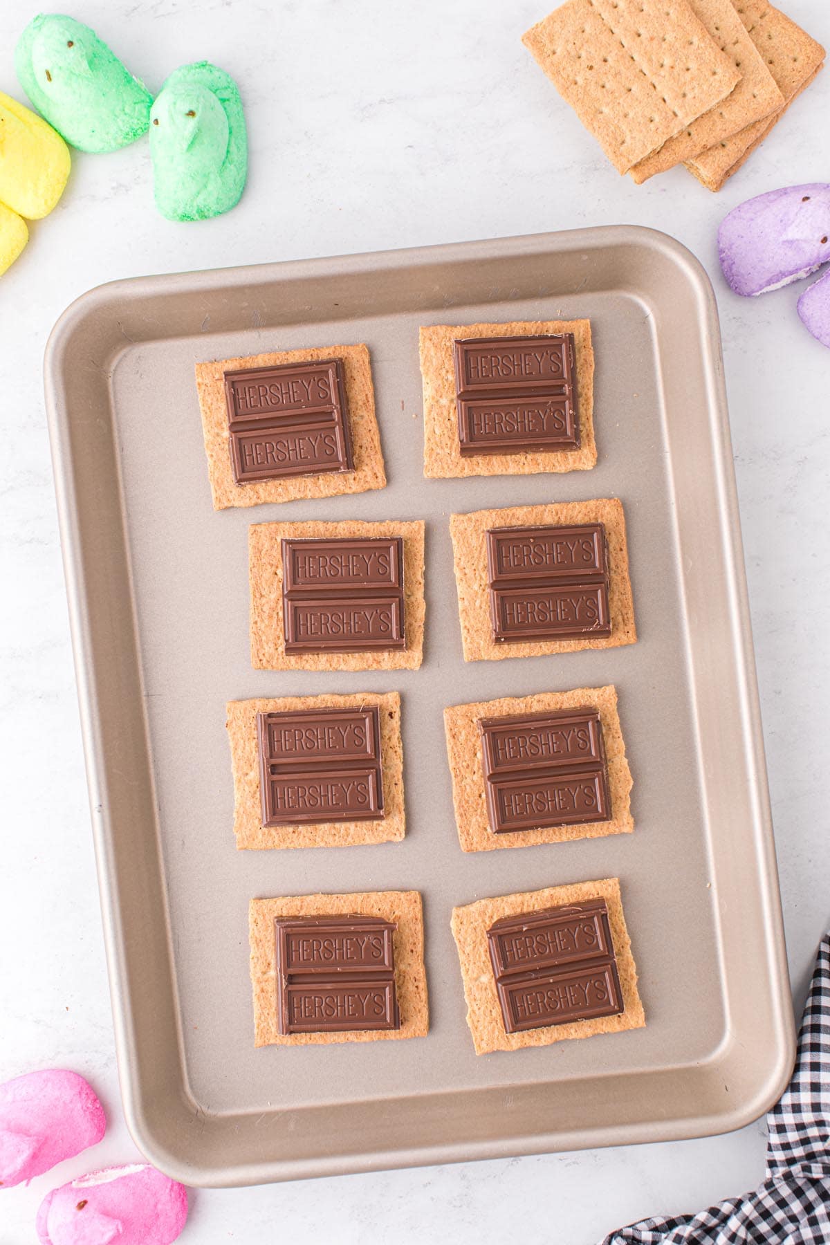 place chocolate piece on top of graham crackers