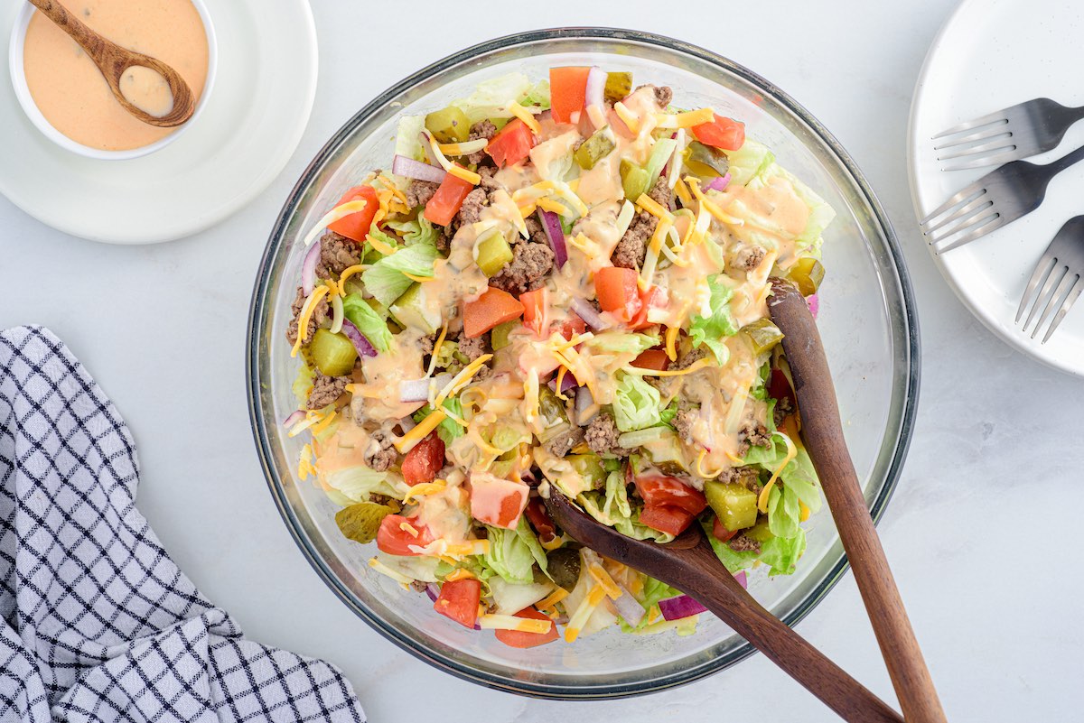 big mac salad in a bowl with wooden stick