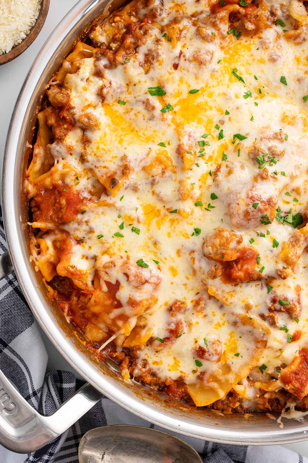 one pot skillet lasagna with cheese on top. 