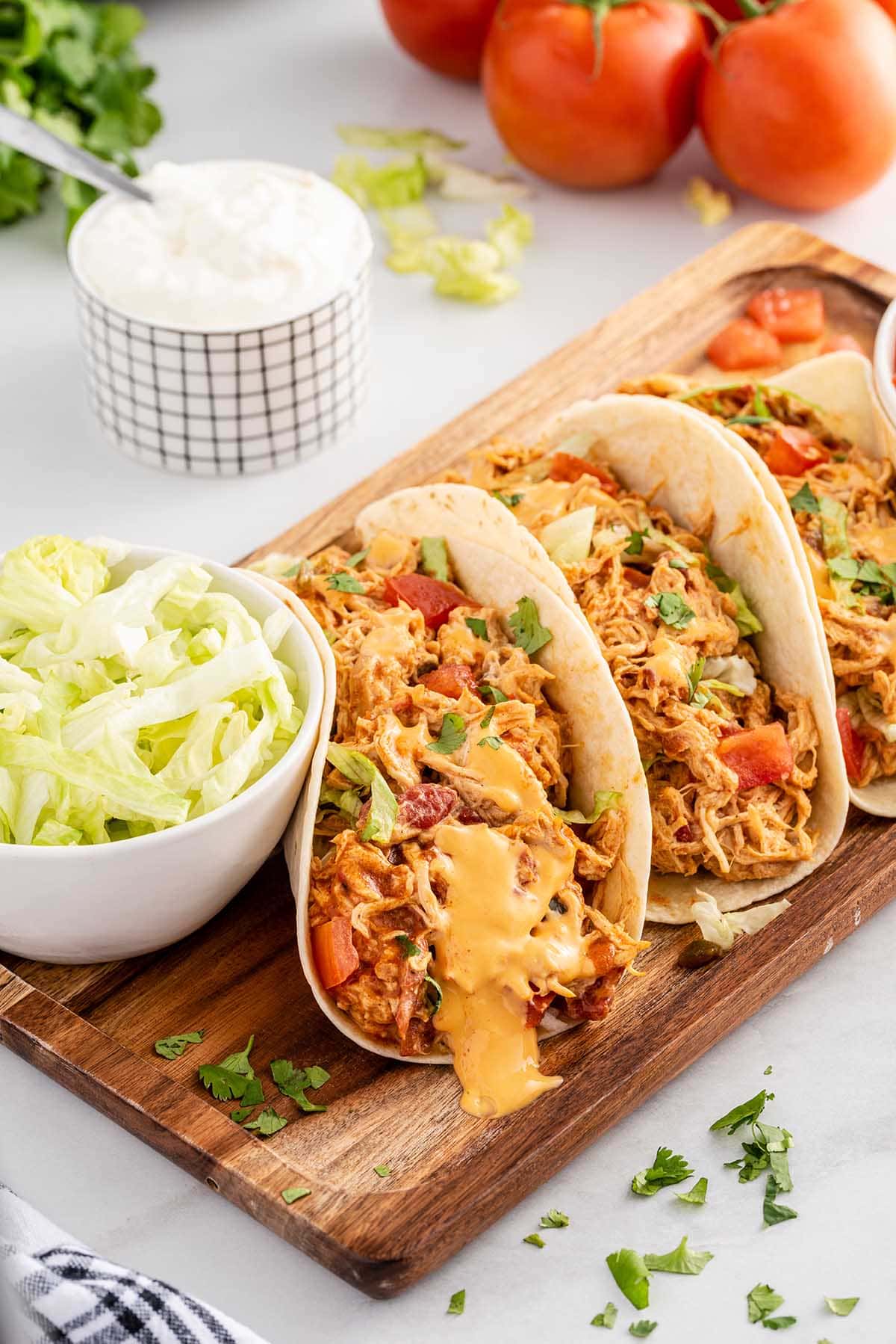slow cooker queso chicken tacos hero image