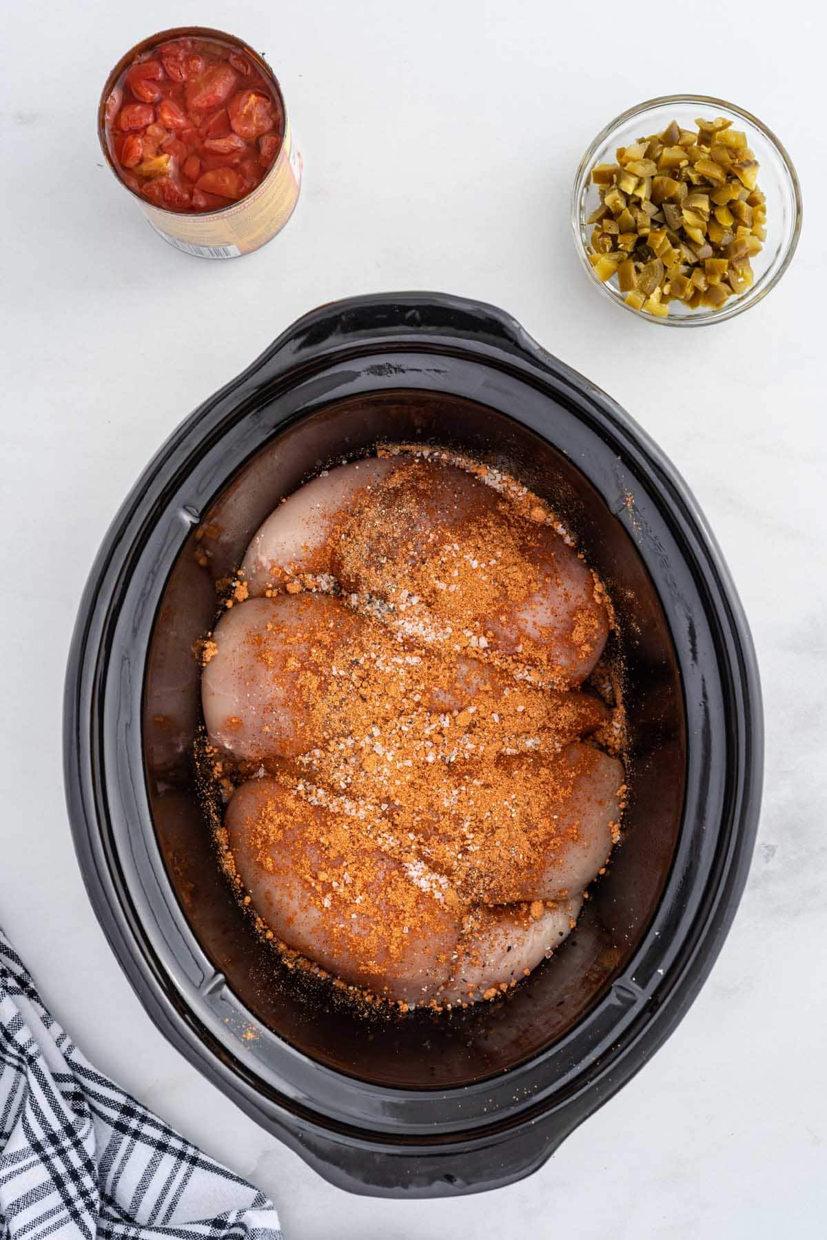 place chicken and seasoning in slow cooker