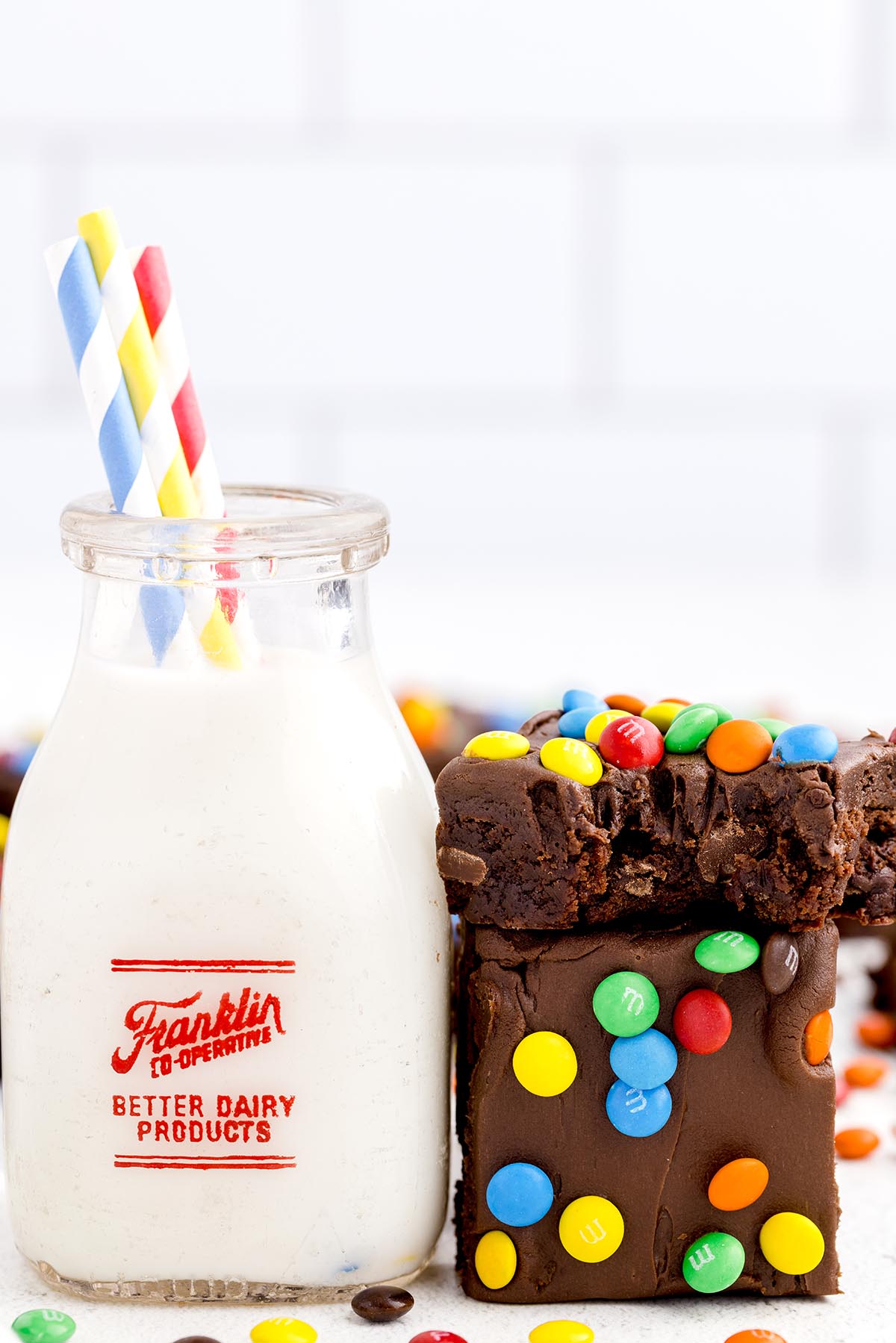 brownie beside a jug of milk