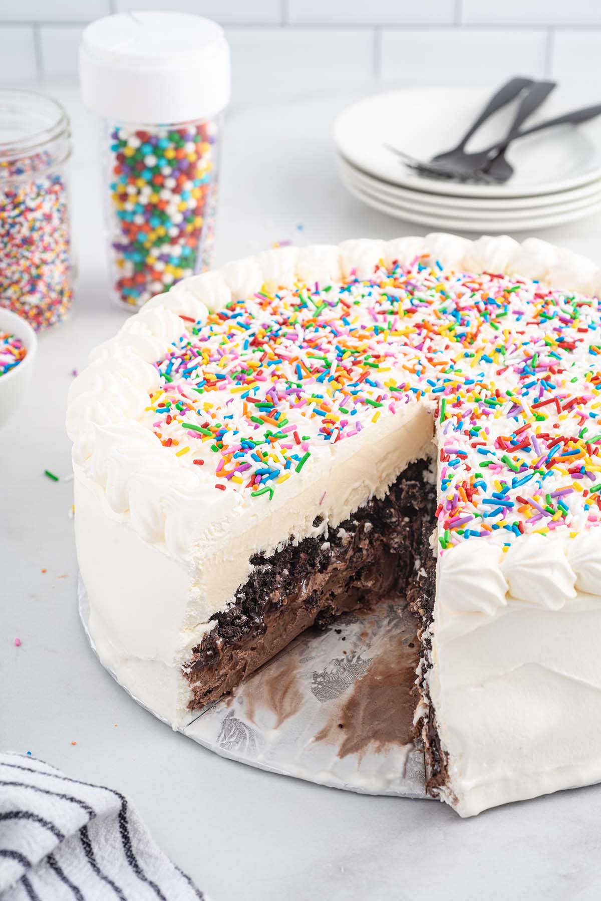 cutting a triangle slice from Copycat Dairy Queen Ice Cream Cake