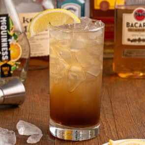 texas tea in a glass on top of wooden table.